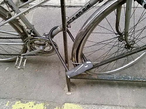 Lock both wheel and frame at once for best results.