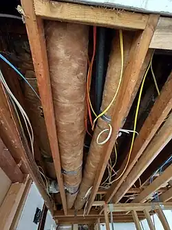 Part of the ceiling needs to be suspended because it holds the ducts of our forced air heating system.