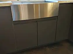 The element above the pair of doors is a flipped drawer front that is cut to size.