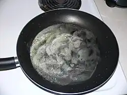 2. Melt butter in a large frying pan.