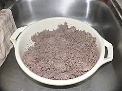 Draining the grease from the beef