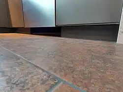 The dish washer came with its own toe kick panel