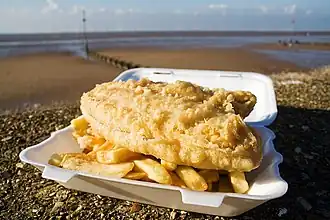 Fish and chips on the seafront at Hunstanton, Norfolk UK. In this instance the fish is deep fried plaice.