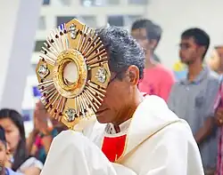 Monstrance - an open or transparent receptacle in which the consecrated Host is exposed for veneration