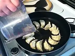 Step 10: Pour in ½ cup water.