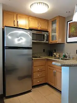 Huge fridge! Notice the cook top being positioned between fridge and sink.