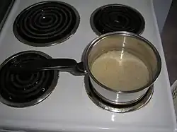 5. Place saucepan on stove and set temperature to "high". Do not cover.