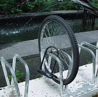 The only parts of your bike a lock protects are the parts you actually lock. Bike thieves are more than happy to quickly and easily make off with the rest of your bike if you only lock a wheel to a post - the quick release system of most bikes makes such a feat a cinch.