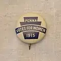 1915 Women's suffrage clothing pin featuring a keystone symbol