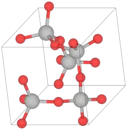 Unit cell of α-cristobalite; red spheres are oxygen atoms. We see here five silicon atoms in a helix (the first and the last are equivalent atoms in the lattice) going in the "c" direction (into the page). The horizontal and vertical axes are the "a" axes.