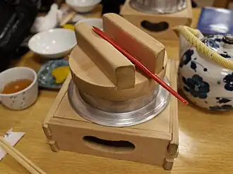 Kamameshi cooking in the kama