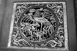 Image 54Relief of a fenghuang in Fuxi Temple (Tianshui). They are mythological birds of East Asia that reign over all other birds. (from Chinese culture)
