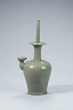 Celadon Buddhist ritual sprinkler with phragmites and wild goose design in relief