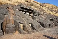 General view, with the top of the chaitya entrance columns visible, and the outside stupa