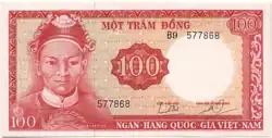 A light-coloured rectangular paper banknote with a red foreground. A young-looking, unwrinkled, clean-shaven round-headed man with an ornamental headpiece and his shoulders are visible to the left. "100" appears to the centre in a red ring. A red border is present.