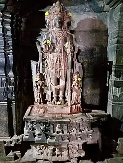 Chaturmukha, four-faced Brahma inside with Jaina-base decoration