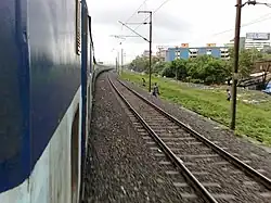 19132 Kutch Express at a curve outside Surat