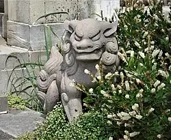 A Foo Dog sculpture in the Walled Garden
