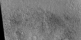 Boulders that were picked up, carried, and dropped by tsunamis, as seen by HiRISE. The boulders are between the size of cars and houses.