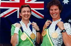 women holding medals