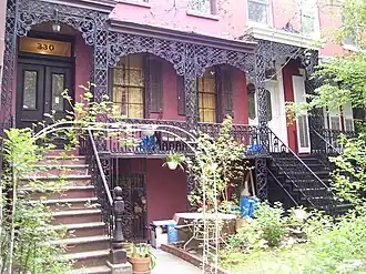 Italianate townhouses[135] on East 18th Street (1853), with cast-iron verandas reminiscent of the French Quarter of New Orleans.[134]