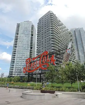Building at 46-10 Center Boulevard as seen behind the Pepsi-Cola sign in 2015