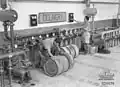 Australian troops using captured Italian 200&nbsp;L drums and filling equipment, Tobruk, Libya 1941