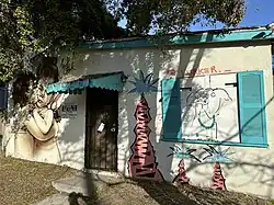 A building on Horizon Avenue features both Claire Salvo on the right and Jules Muck on the left.
