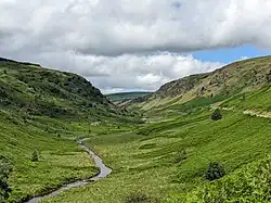 A view into the Abergwesyn valley, looking north-west. The river Irfon can be seen in the centre of the valley.
