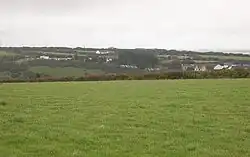Across the valley to Barkla Shop from a spot near Ropewalk Farm looks east across the valley. The village of Mithian lies over the far hillside.