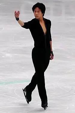 Adam Siao Him Fa performs on the ice.