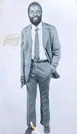 A digitally cropped photograph of Adamson Mushala (in a suit) in 1975.