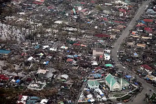 Image 3Aerial image of destroyed houses in Tacloban, following Typhoon Haiyan (from Effects of tropical cyclones)