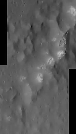 Hollows along the southeastern peak ring