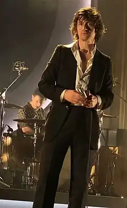 Turner performing with Arctic Monkeys in 2023