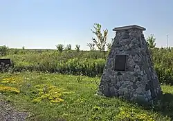 Cairn and plaque on Almond Avenue in Almond Village