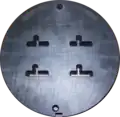 Front side of a four family die. The die is 228 mm (9.0 in) in diameter.