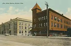 Three-story brick building with tower