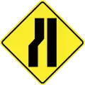 Road narrows on the left side