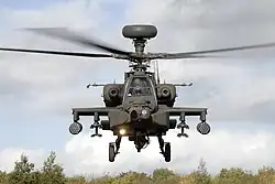 Front-end view of attack helicopter taking off