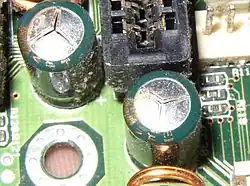 Failed Tayeh capacitors which have vented subtly through their aluminium tops