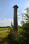 A commemorative roofed pole to the exiled villagers from Bajėnai I