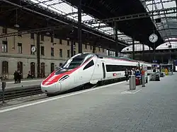 A train awaits departure for Italy.