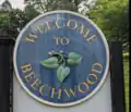 Sign on the slope of the station along Karakung Drive, welcoming the Beechwood neighborhood.