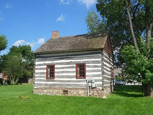 Old log cabin that was moved to a site behind the post office