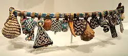 Belt (Yet); possibly early 1900s; cord, leather, glass beads, shells; Cleveland Museum of Art (USA). Like some of the masks, this belt is decorated with colorful beads.