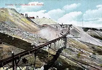 Mining with sluices on hillside at Klondike, 1898