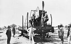 Bibescu with a Blériot plane of the Romanian military during the Second Balkan War. To the left looking at the plane is Aurel Vlaicu.