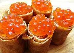 Blini served with red caviar