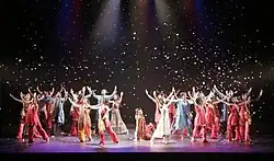 Large group of dancers onstage